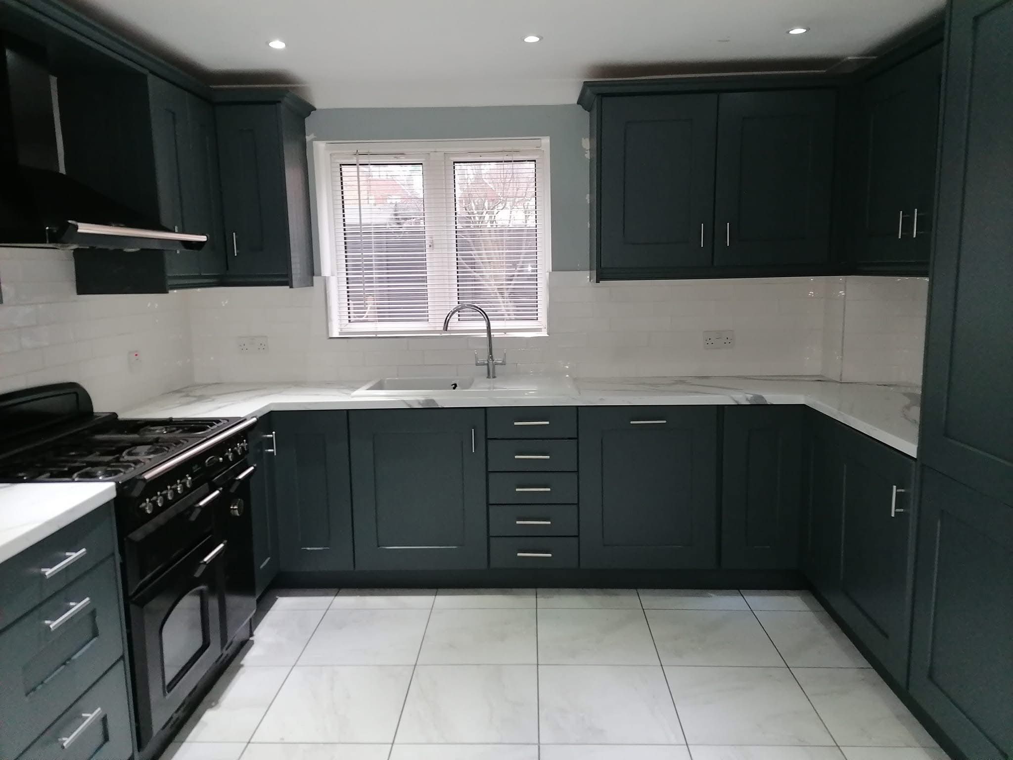 Kitchen cabinets resprayed in a rich dark finish