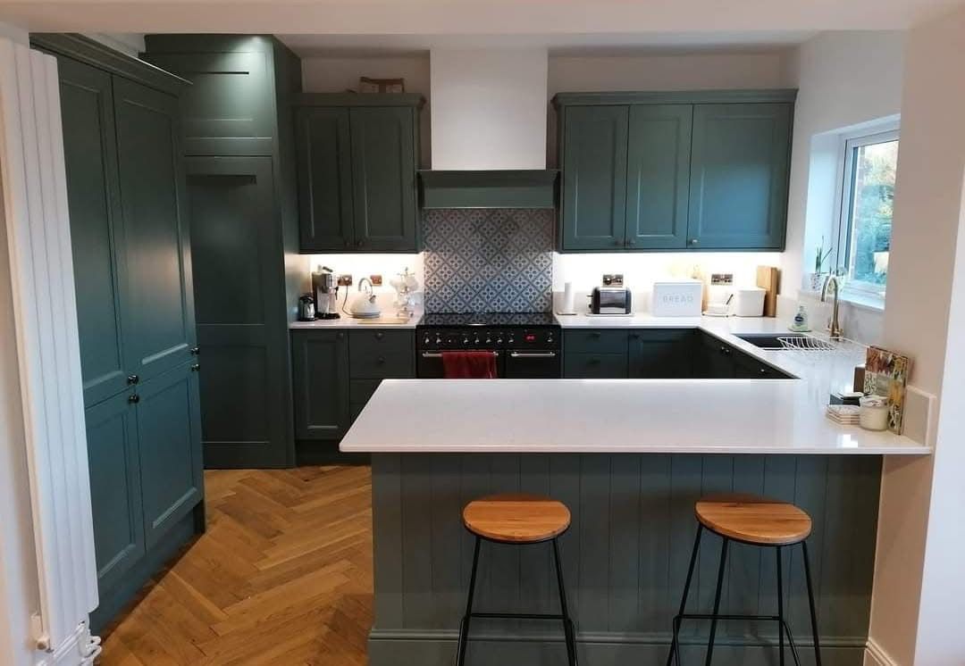 Resprayed kitchen cabinets in a deep blue finish